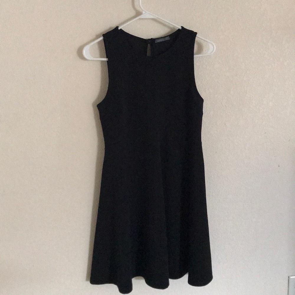 Black sleeveless dress.